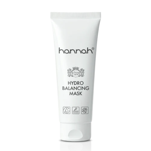 hannah Hydro Balancing Mask 65 ml, een hydraterend masker met hyaluronzuur voor een droge, vochtarme huid die dof oogt en spanning vertoont. Op de foto een witte tube met zwarte merknaam hannah en schroefdop tegen een rustige achtergrond, waarbij het compacte 65 ml formaat goed in beeld komt. Herstelt de vochtbalans en kalmeert zichtbaar. Puur Diana Shop Nuenen