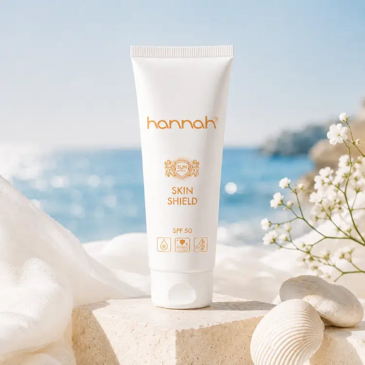 hannah Skin Shield SPF 50 dagcrème voor gevoelige huid in zomerse kustsetting met schelpen
Titel tekst afbeelding
